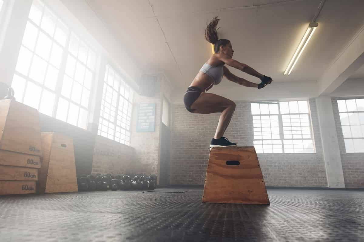 athlete training with plyo box box jumps