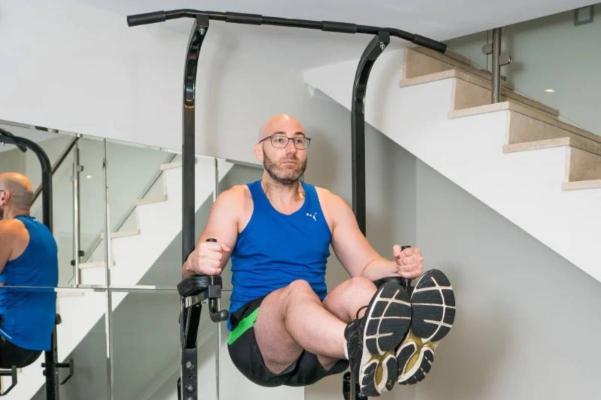 athlete training on the power tower at home