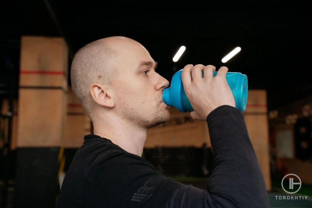 athlete drinks protein