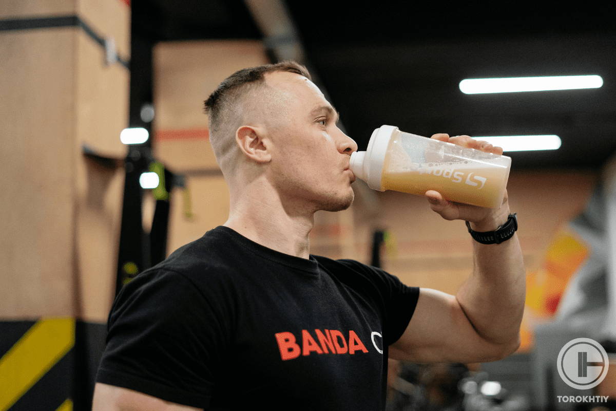 athlete ready to start training holding protein in hands