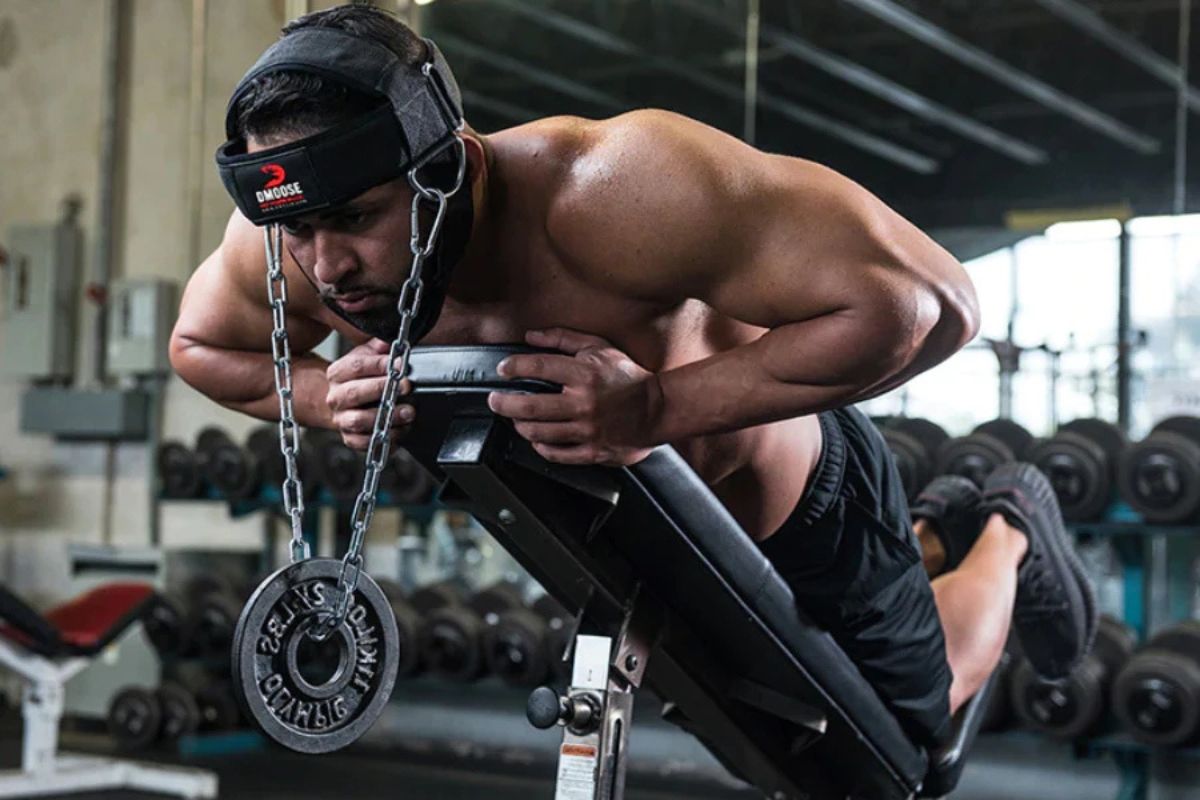 Man doing an exercise with the dmoose neck harness