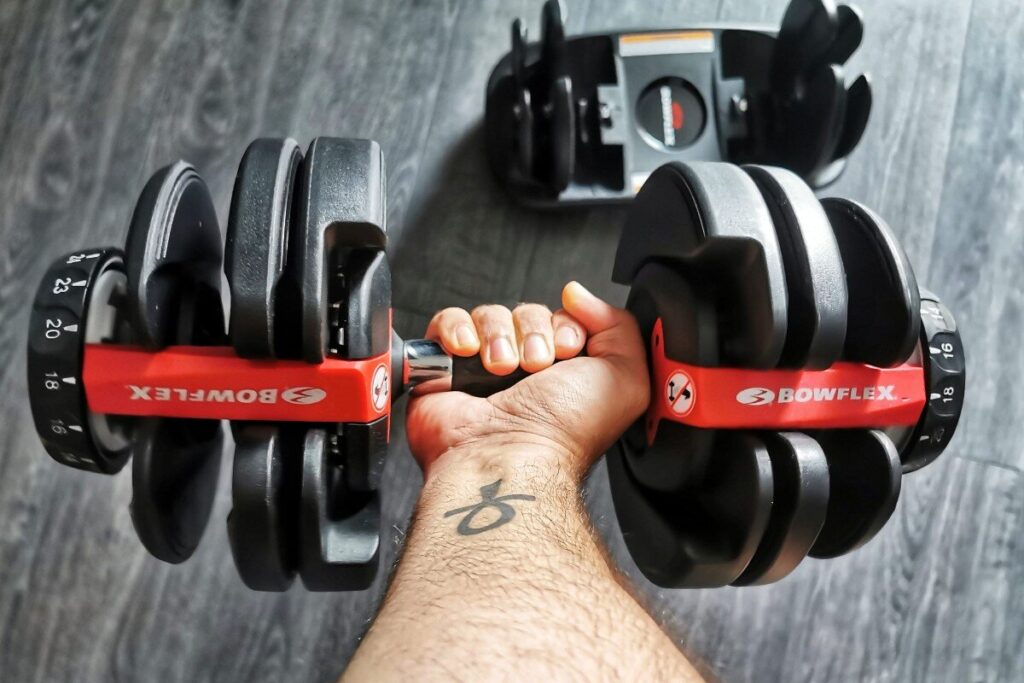 man holds bowflex select