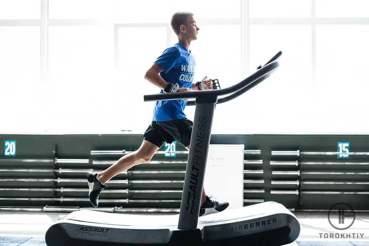 young athlete jogs on treadmill