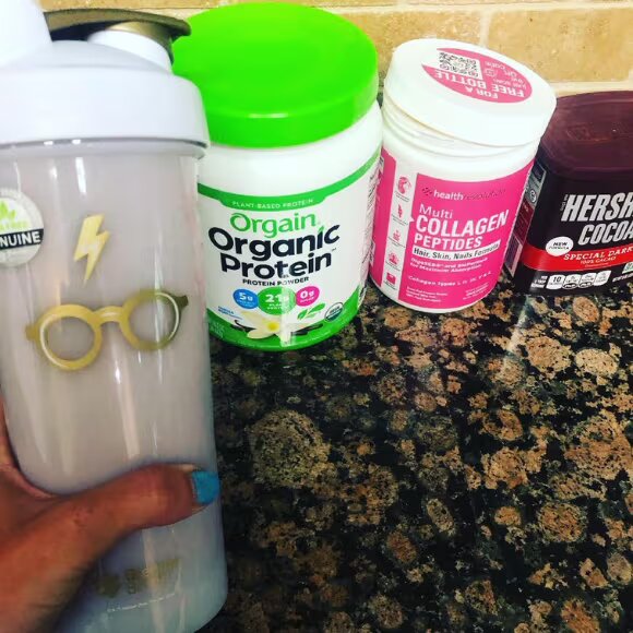 orgain protein powder bottle on table