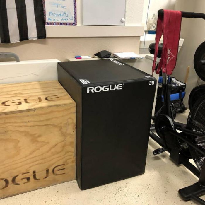 athlete shows his plyo box rogue