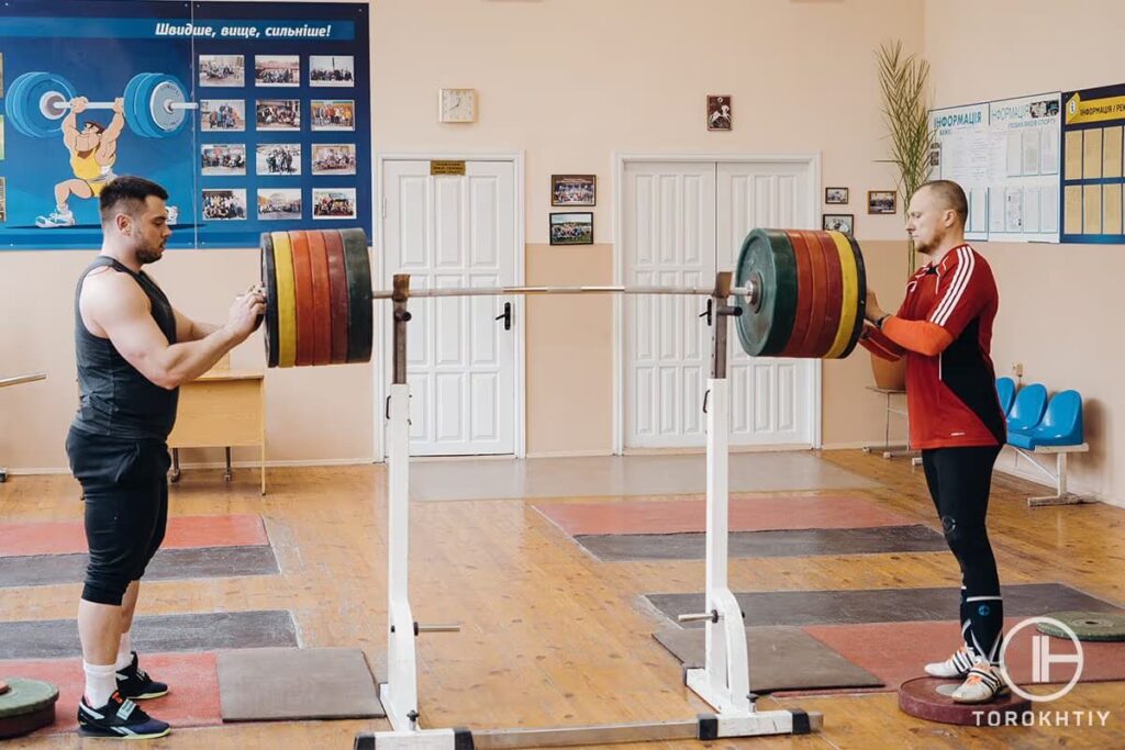 Athlete with Barbell on J Hooks