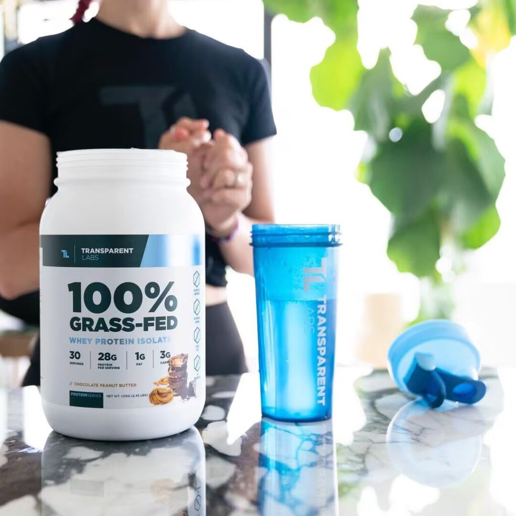 woman and transparent labs bottle on table