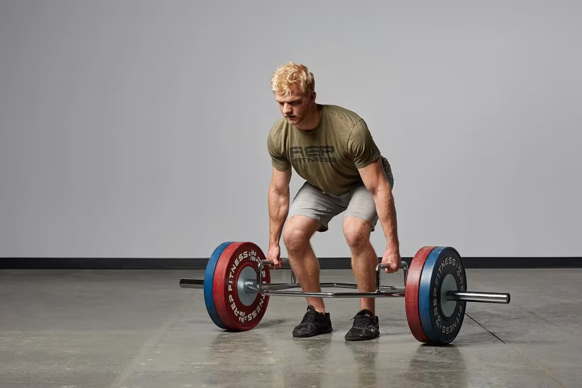 man lifts trap bar