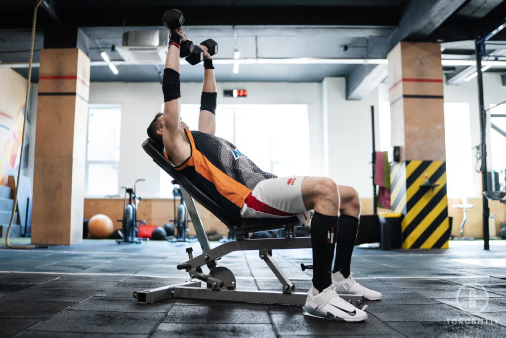 Torokhtiy Athlete Preforming Dumbell Press